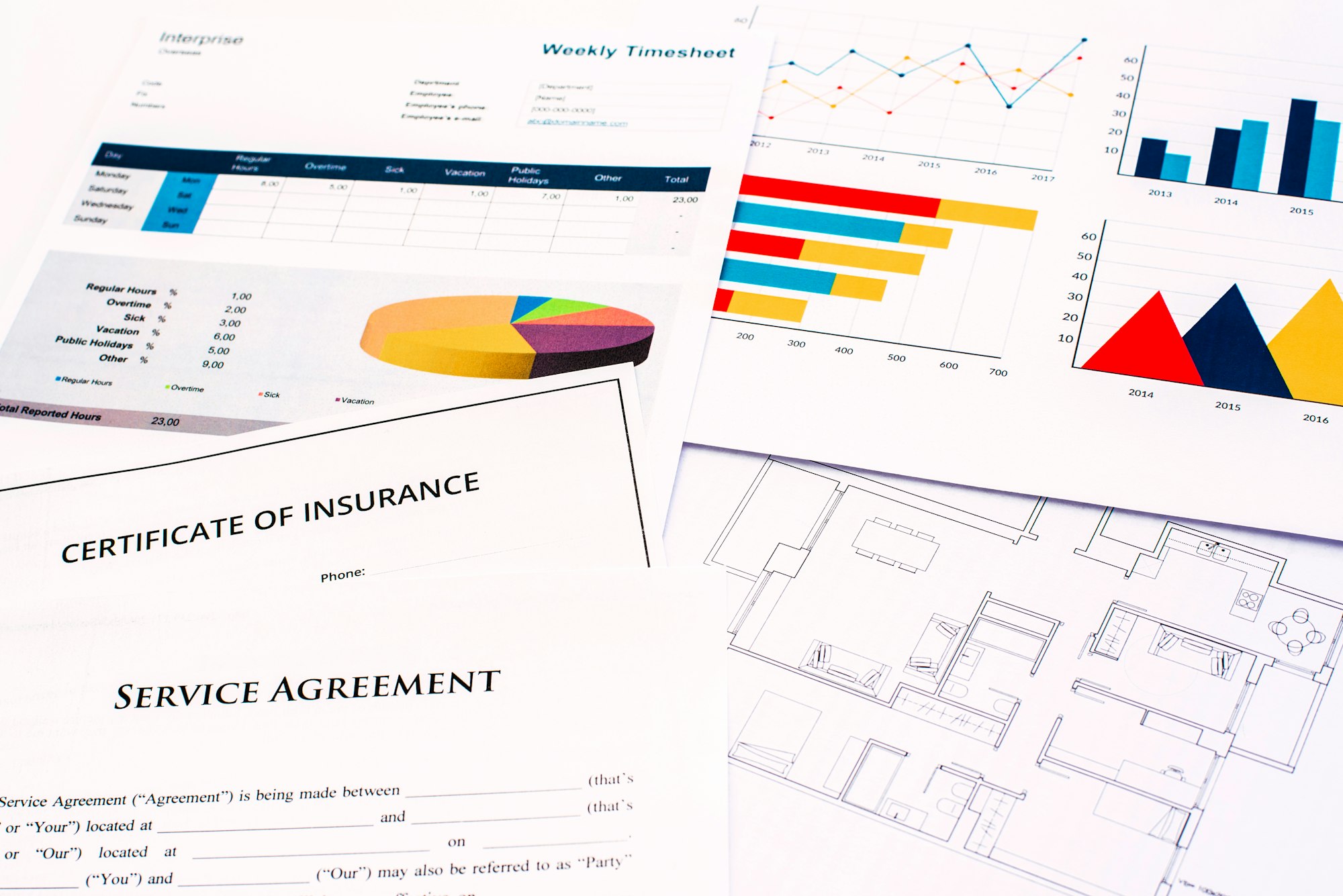 Plans and financial documents with costs, in the real state business.